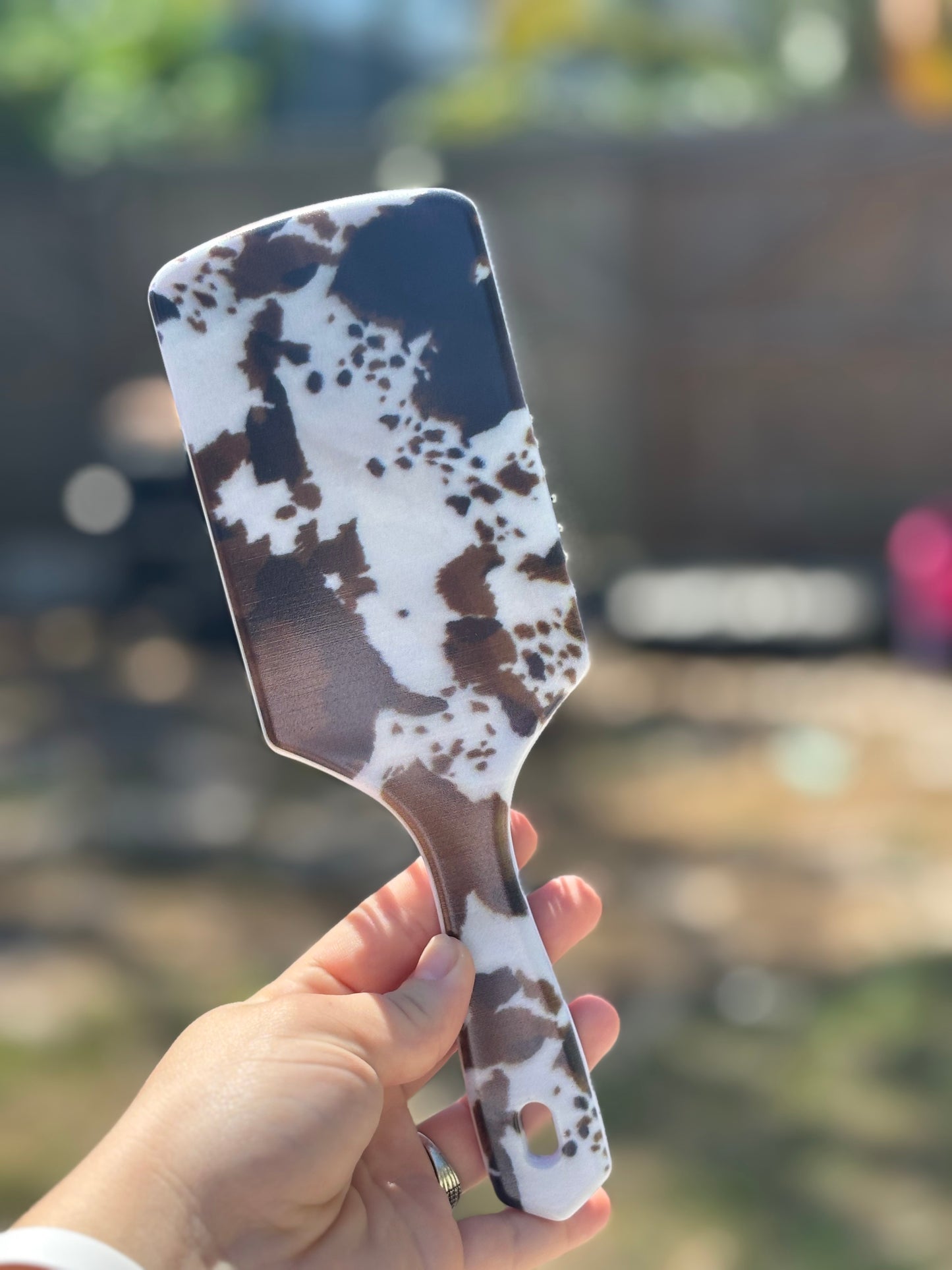 black and brown cow print hair brush