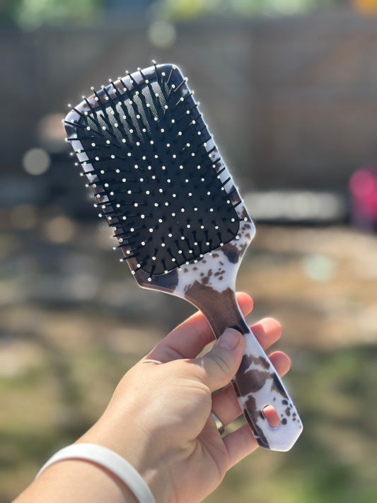 black and brown cow print hair brush