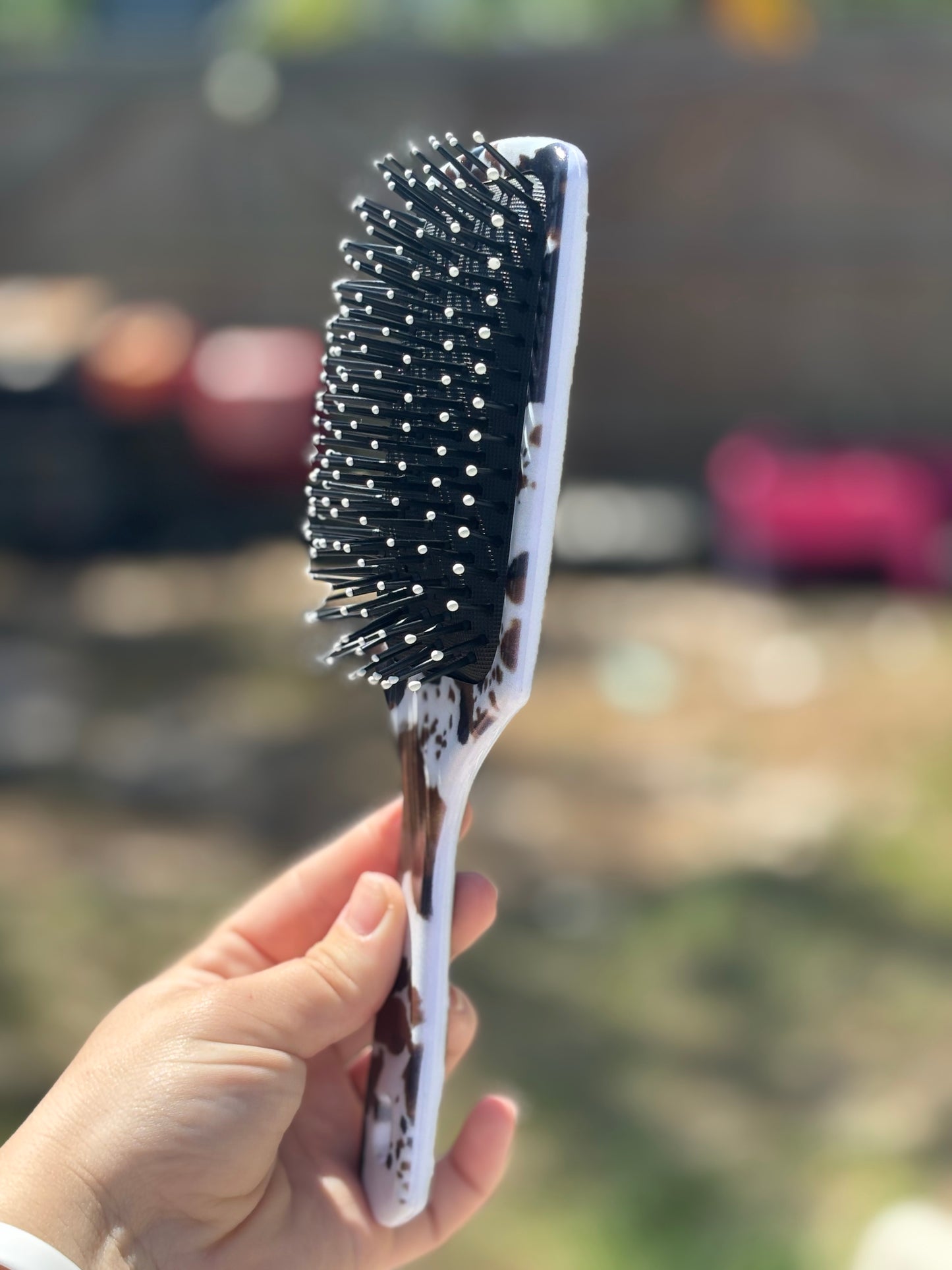 black and brown cow print hair brush